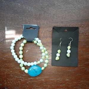 Two Skull bracelets and earring set.